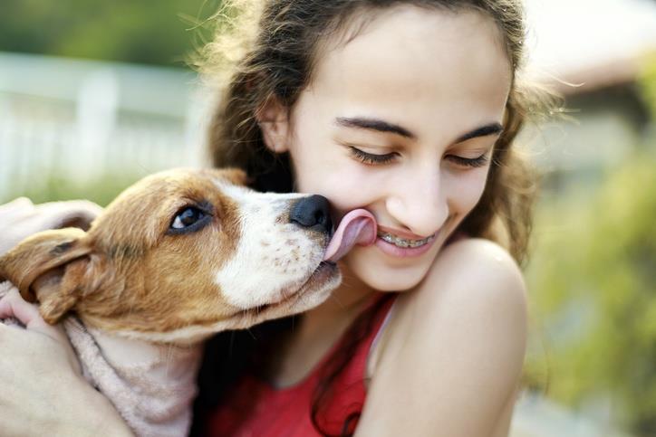 A girl playing with her pet