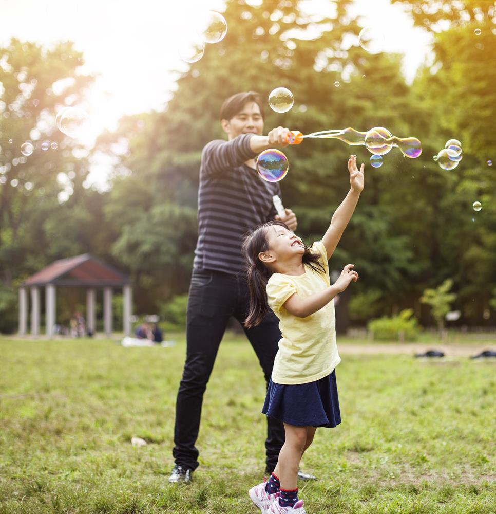 A daughter playing with her father