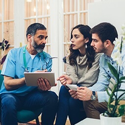 Doctor consulting couple