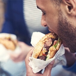 Man eating burger