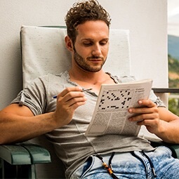 Man doing crossword